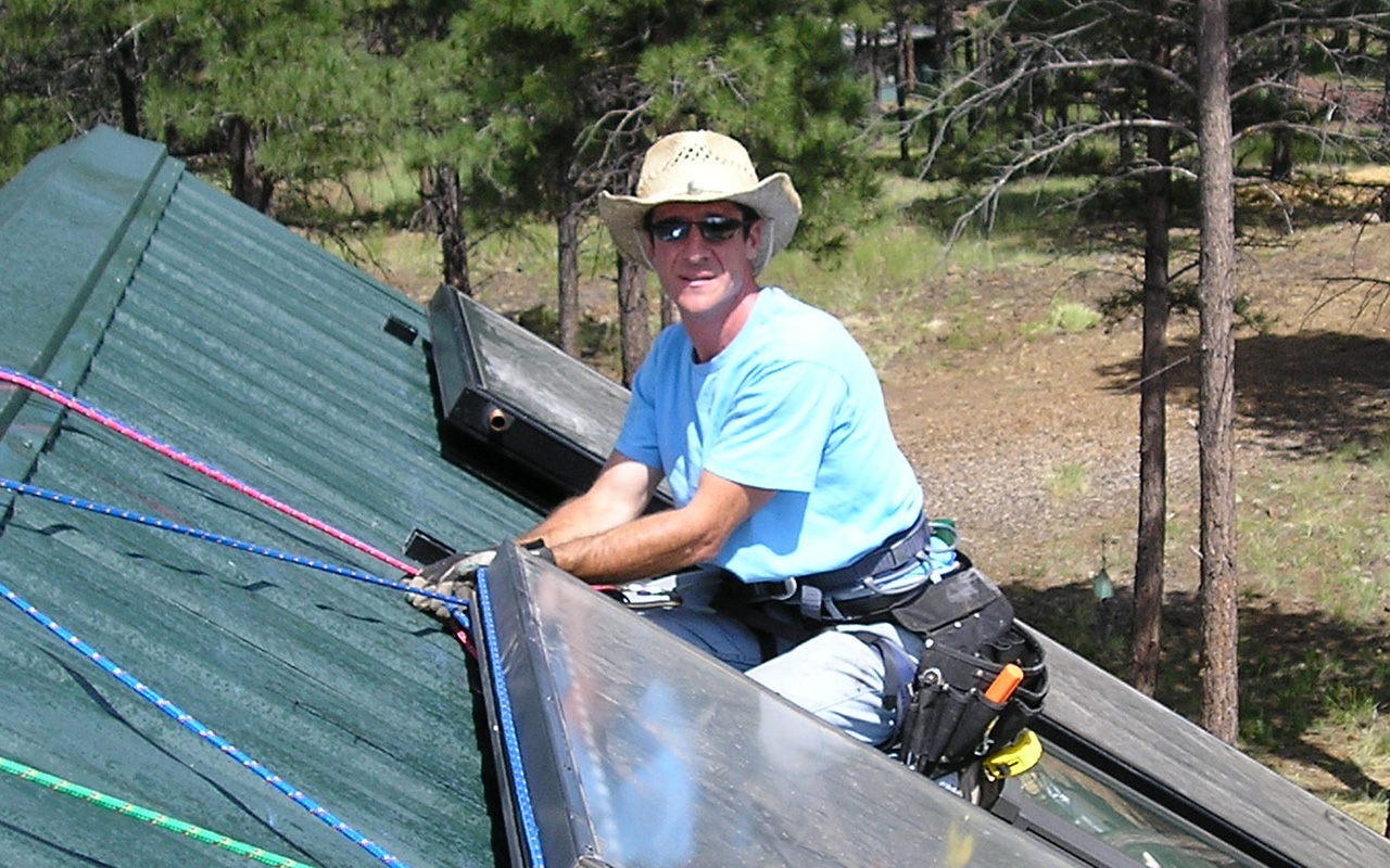 Peter Biondo installing solar panels